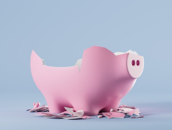 Symbolbild mit einem zerschlagenen rosa Sparschwein